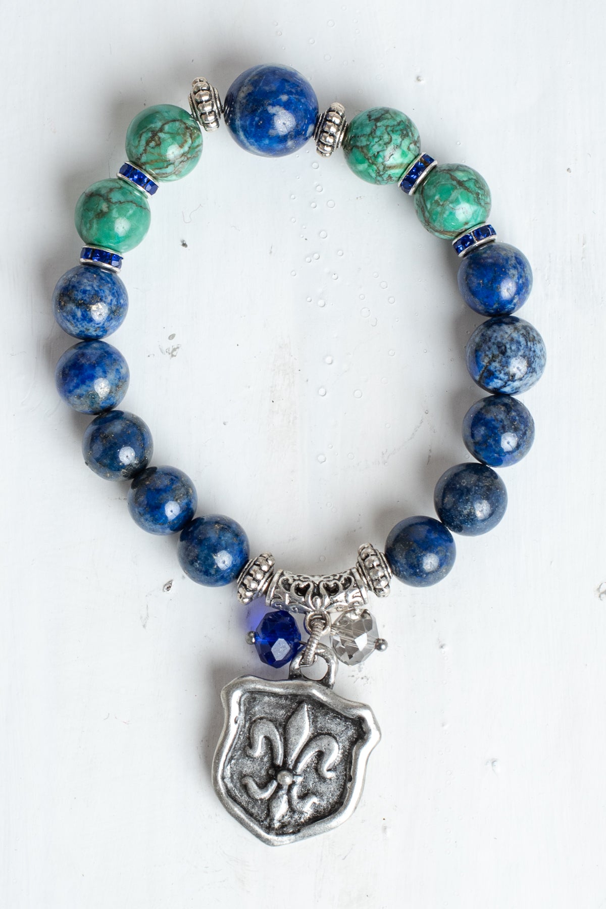 Blue Sodalite and Green Turquoise Stone Bead Stretch Bracelet with Silver Fleur de Lis Shield Charm