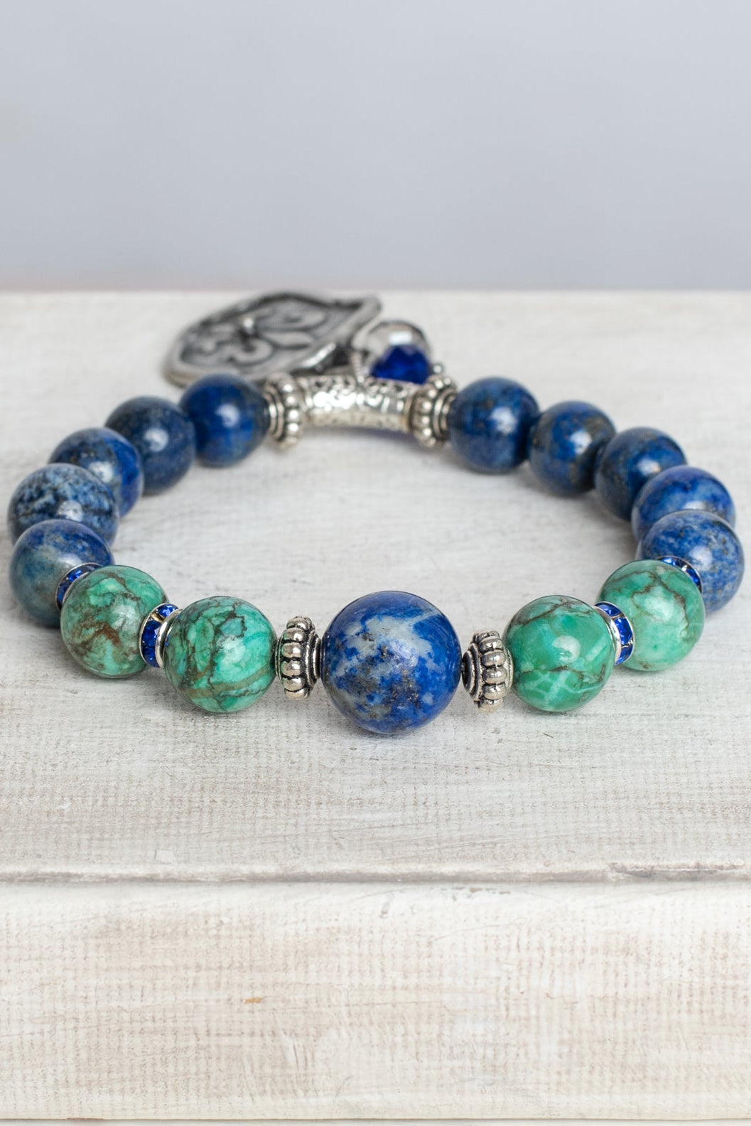 Blue Sodalite and Green Turquoise Stone Bead Stretch Bracelet with Silver Fleur de Lis Shield Charm