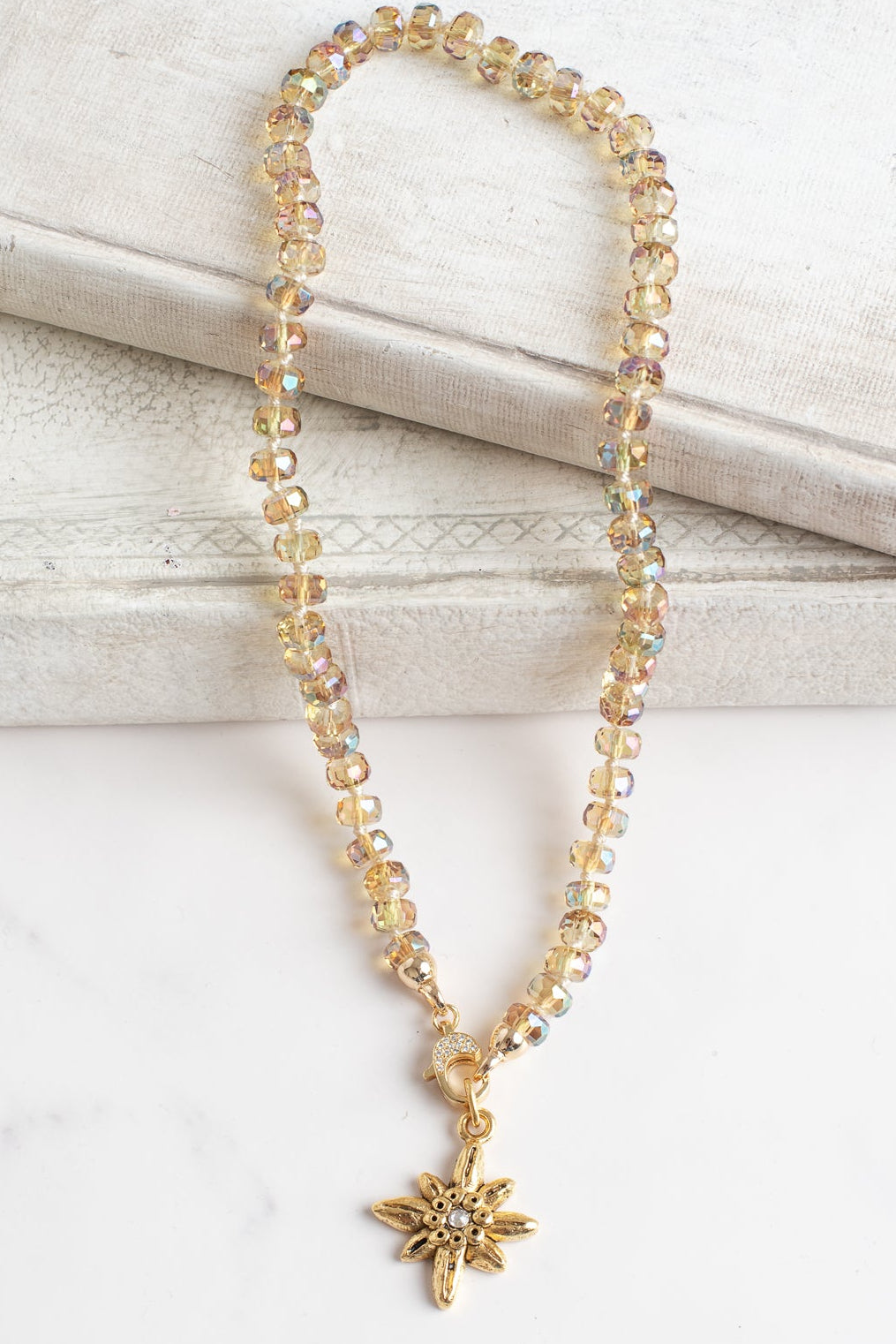 Floral Gold Plated Pendant with White Crystal on a Gold Crystal Necklace