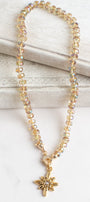 Floral Gold Plated Pendant with White Crystal on a Gold Crystal Necklace