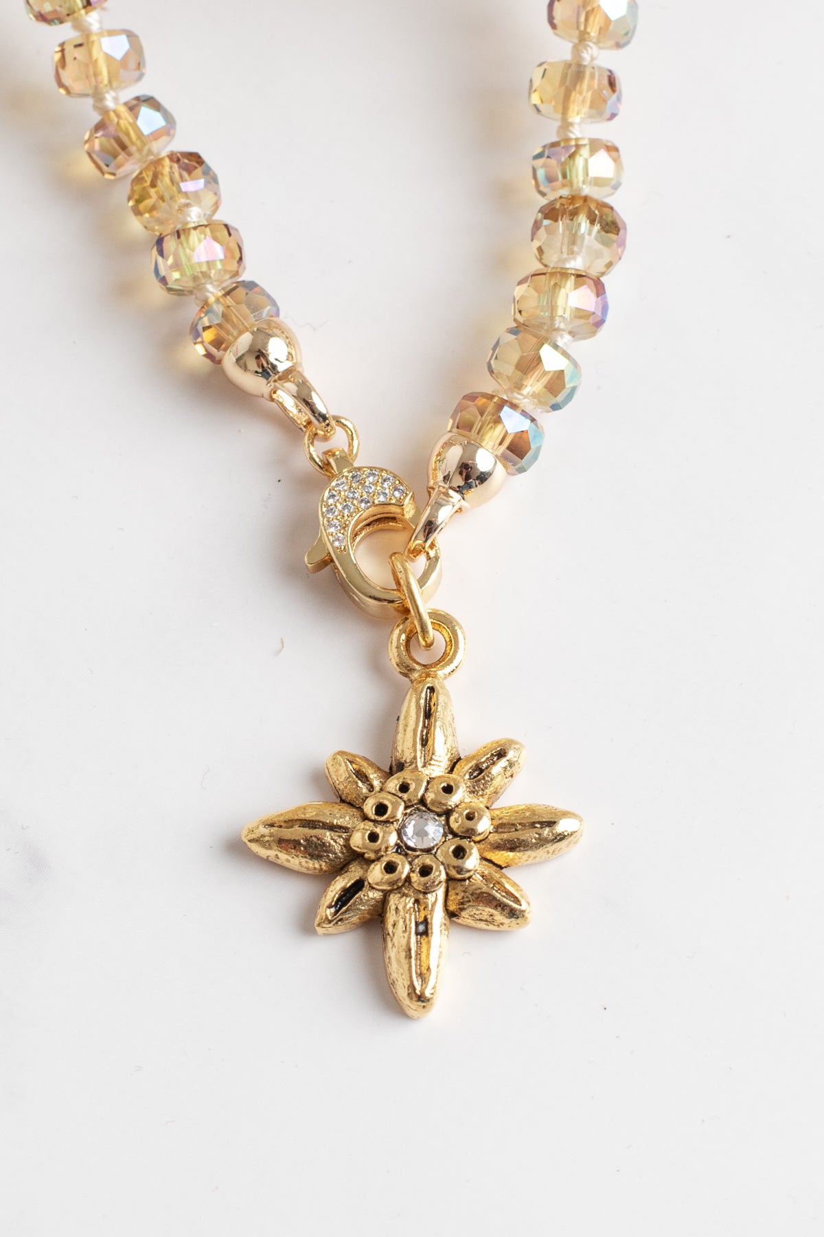 Floral Gold Plated Pendant with White Crystal on a Gold Crystal Necklace