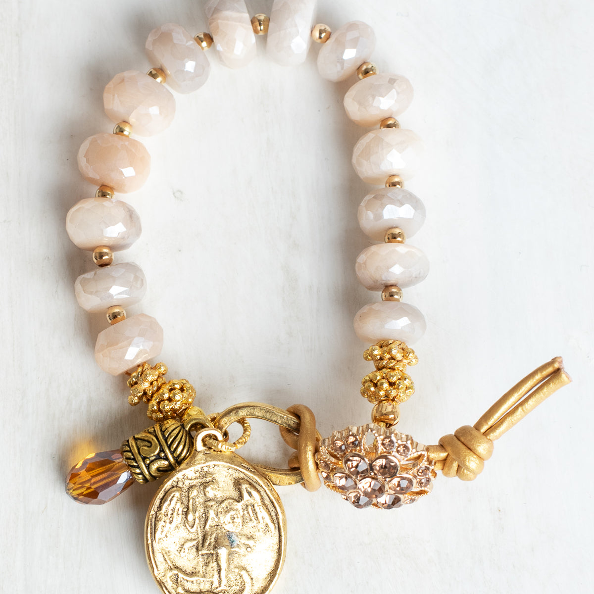 Coated Sapphire Bracelet with Angel Cross Gold Charm, Button and Leather Closure and Crystal