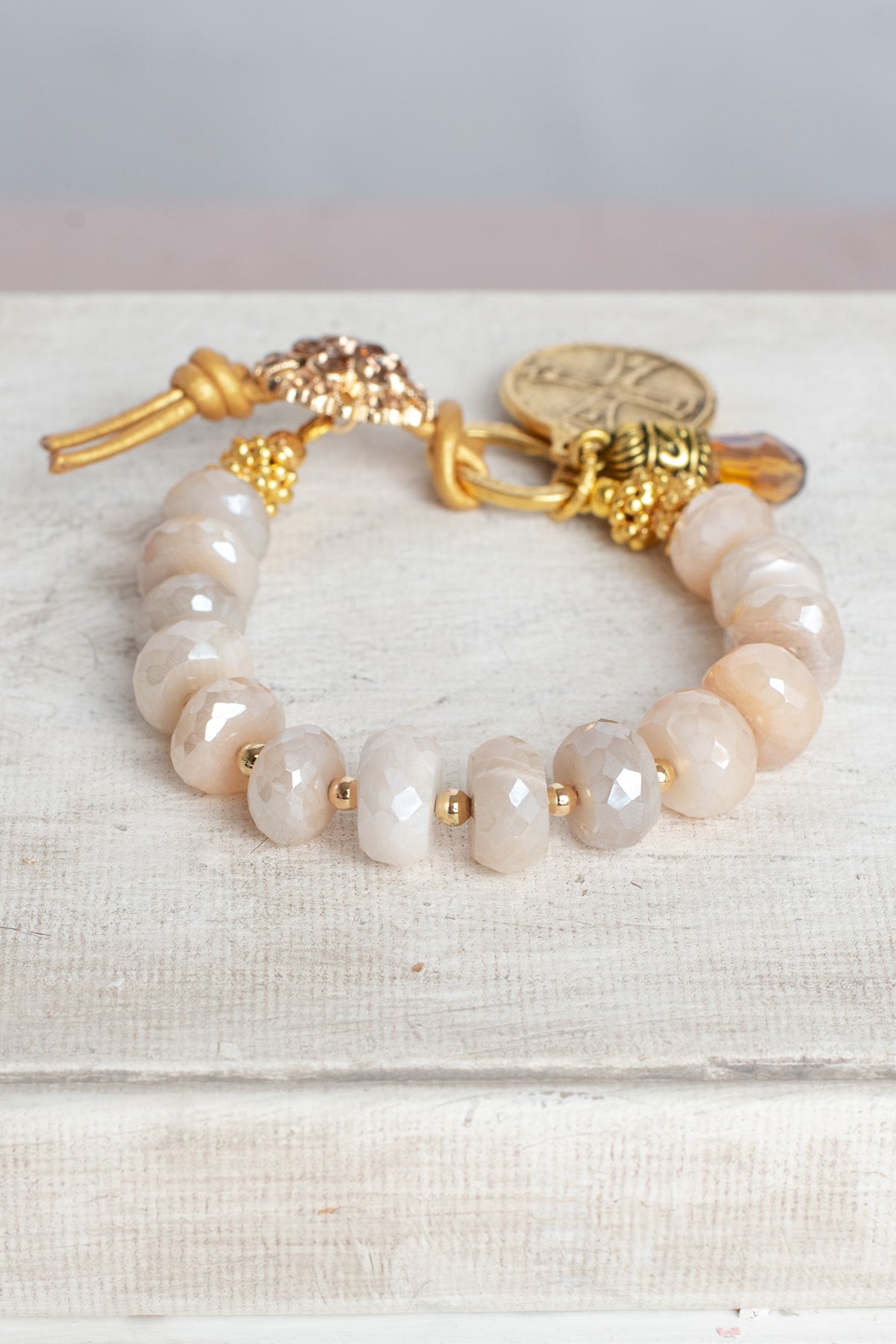 Coated Sapphire Bracelet with Angel Cross Gold Charm, Button and Leather Closure and Crystal