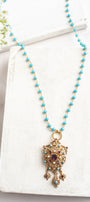 Vintage Gold Designer Brooch Pendant with Purple Rhinestones, Turquoise and Pearl Accents on a Turquoise and Gold Rosary Chain Necklace