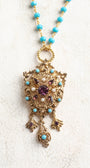 Vintage Gold Designer Brooch Pendant with Purple Rhinestones, Turquoise and Pearl Accents on a Turquoise and Gold Rosary Chain Necklace