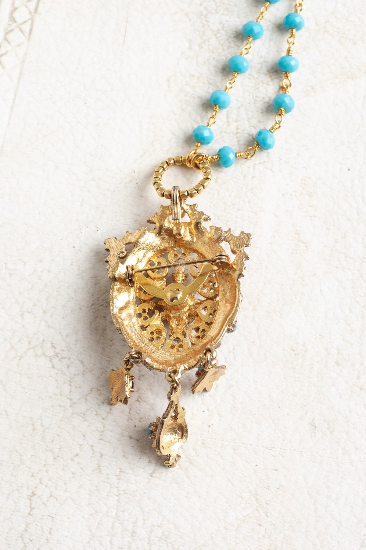 Vintage Gold Designer Brooch Pendant with Purple Rhinestones, Turquoise and Pearl Accents on a Turquoise and Gold Rosary Chain Necklace
