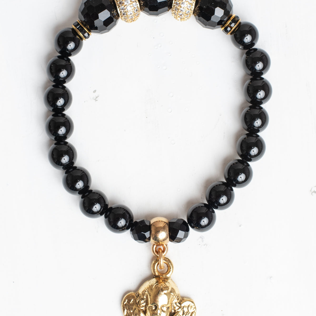 Gold Plated Angel Charm on a black Agate Stone Stretch Bracelet with Micro Pave Focal Beads