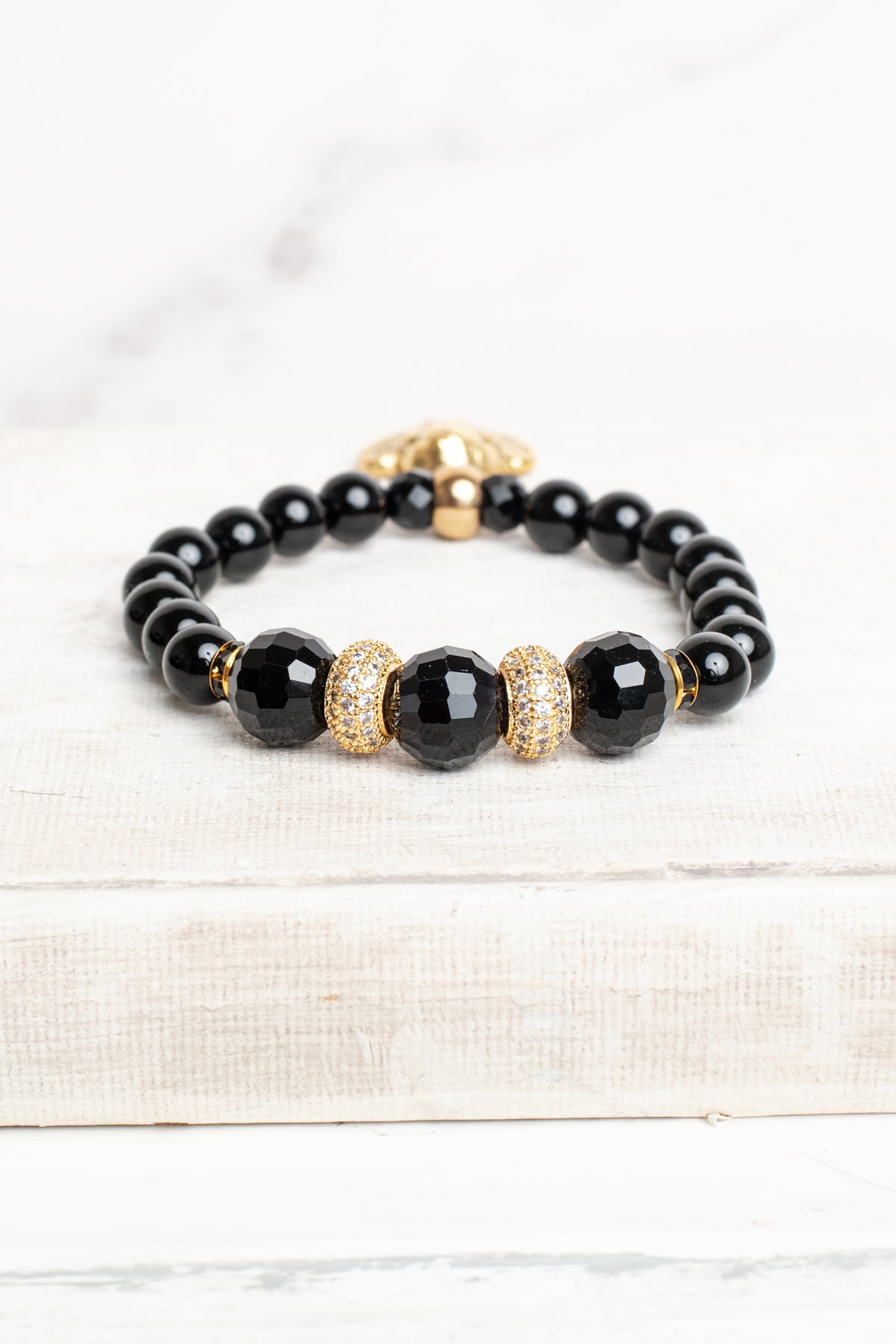 Gold Plated Angel Charm on a black Agate Stone Stretch Bracelet with Micro Pave Focal Beads