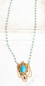 Vintage Gold Plated Florenza Collectible Pendant with Red Rhinestones, Faux Turquoise Cabachon and Chain Draping on a Turquoise and Gold Rosary Chain Necklace