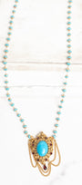 Vintage Gold Plated Florenza Collectible Pendant with Red Rhinestones, Faux Turquoise Cabachon and Chain Draping on a Turquoise and Gold Rosary Chain Necklace
