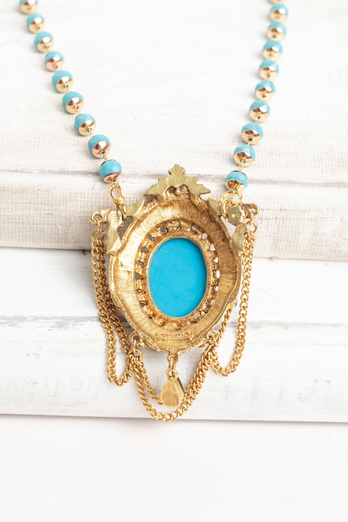 Vintage Gold Plated Florenza Collectible Pendant with Red Rhinestones, Faux Turquoise Cabachon and Chain Draping on a Turquoise and Gold Rosary Chain Necklace