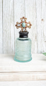 Antique Ornate Aqua Bottle with 1907 Vintage Jewelry Designer Cross Hand Soldered to Top
