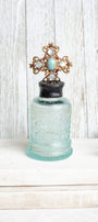 Antique Ornate Aqua Bottle with 1907 Vintage Jewelry Designer Cross Hand Soldered to Top
