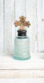 Antique Ornate Aqua Bottle with 1907 Vintage Jewelry Designer Cross Hand Soldered to Top