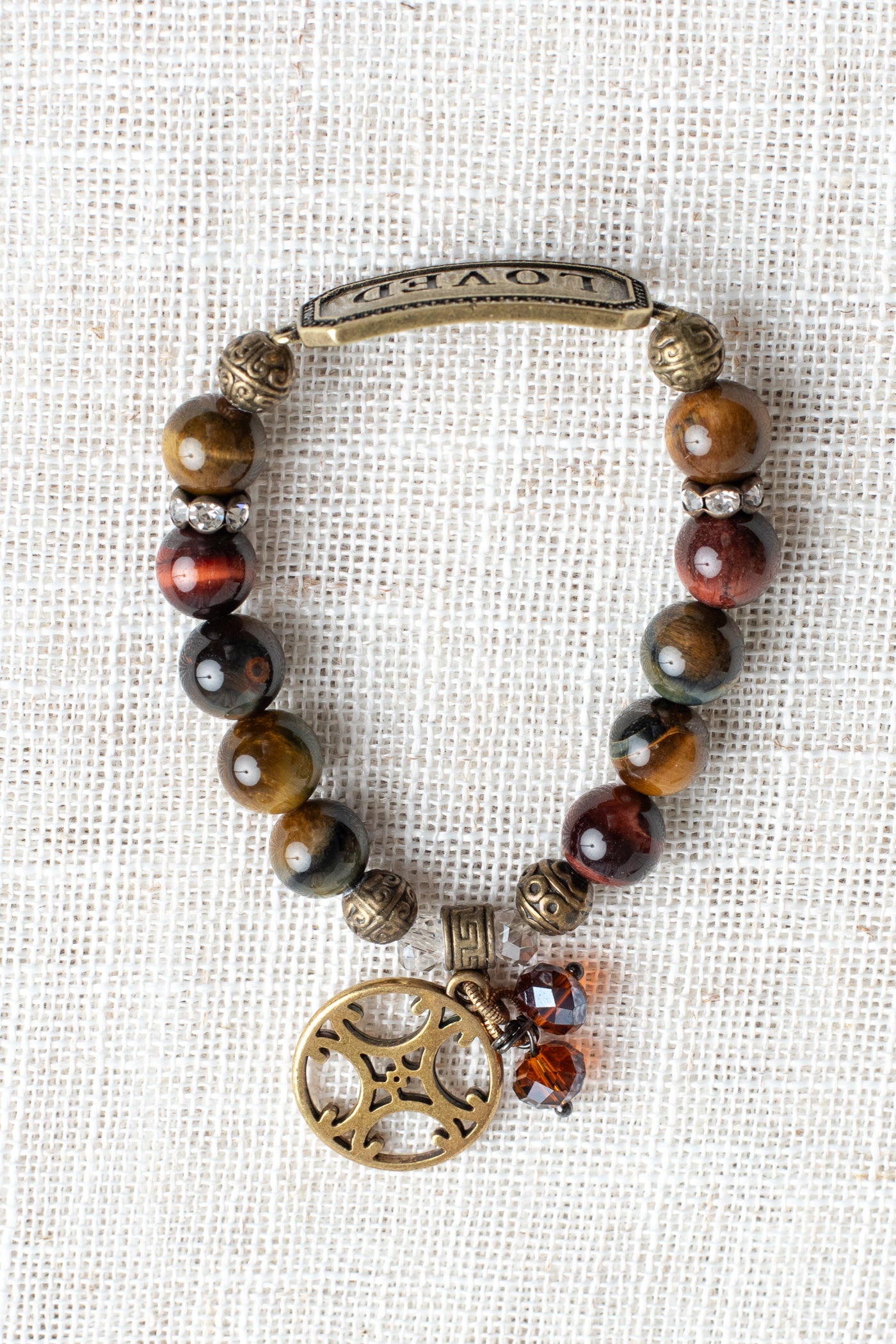 Vintage Style "LOVED" Metal Wrist Plate with Crystal Stones on a Tiger's Eye Stone Stretch Bracelet with Open Cross Style Charm