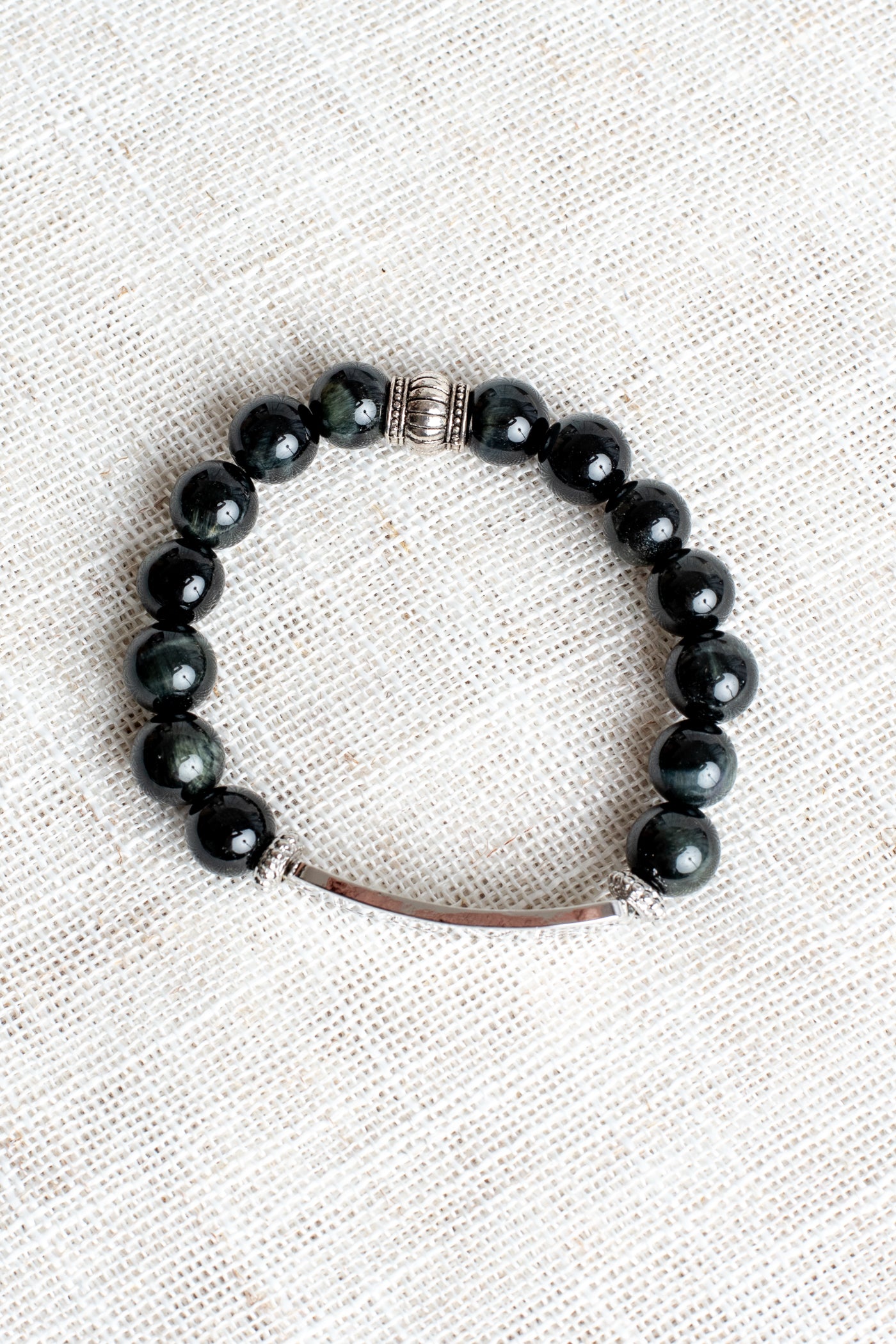 Silver Center Plate with LOVE in Crytal Letters on Black Obsidian Beads with Hints of Gray Stretch Bracelet