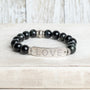 Silver Center Plate with LOVE in Crytal Letters on Black Obsidian Beads with Hints of Gray Stretch Bracelet