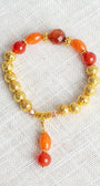 Carnelian and Orange Quartz Stone Beads with 14K Gold Plated Lava Stone Beads on a Stretch Bracelet with Beaded Charm