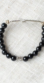 Large Crystal Cross Wrist Charm on a Black Agate Stone Stretch Bracelet
