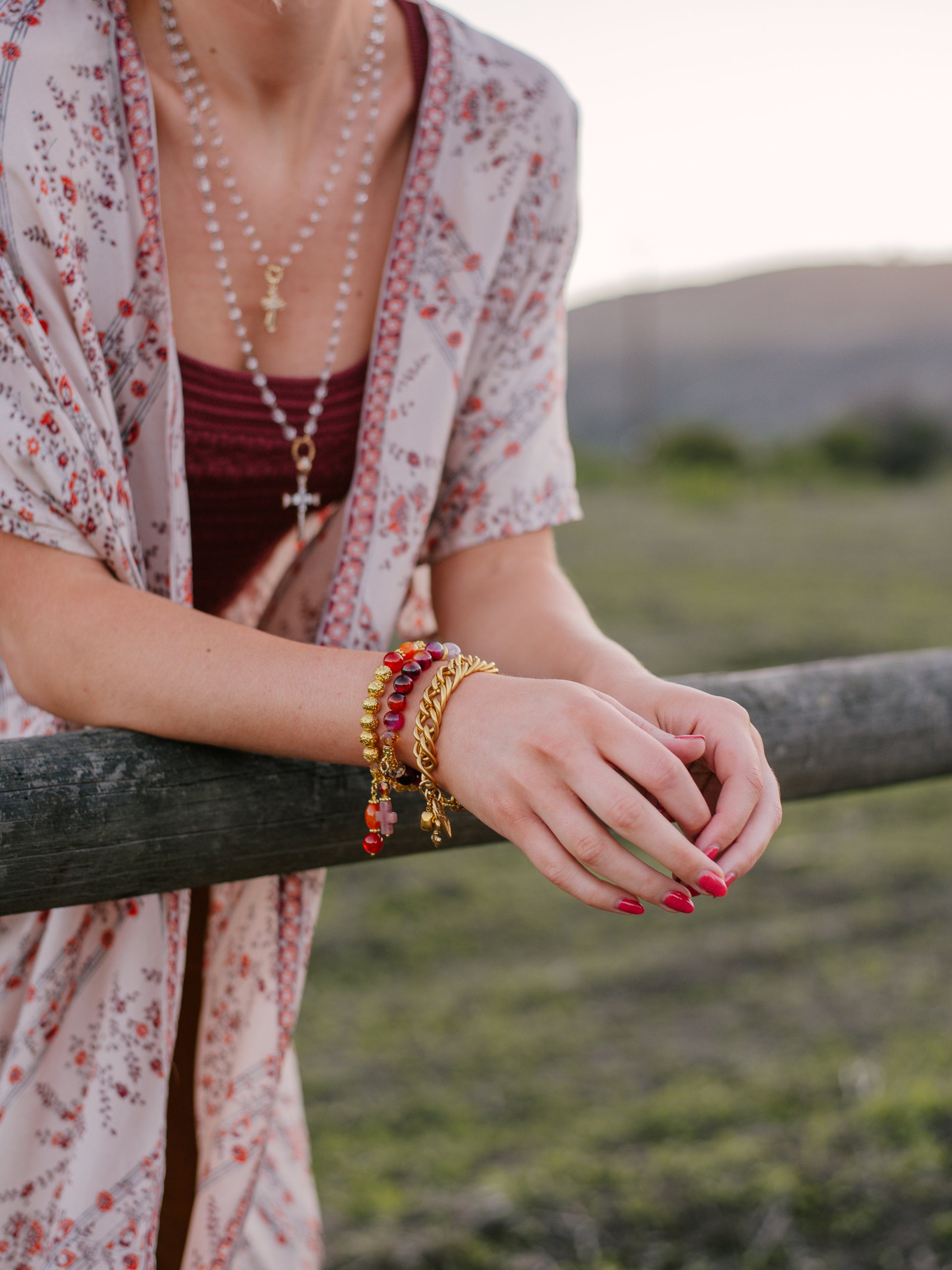 Carnelian and Orange Quartz Stone Beads with 14K Gold Plated Lava Stone Beads on a Stretch Bracelet with Beaded Charm
