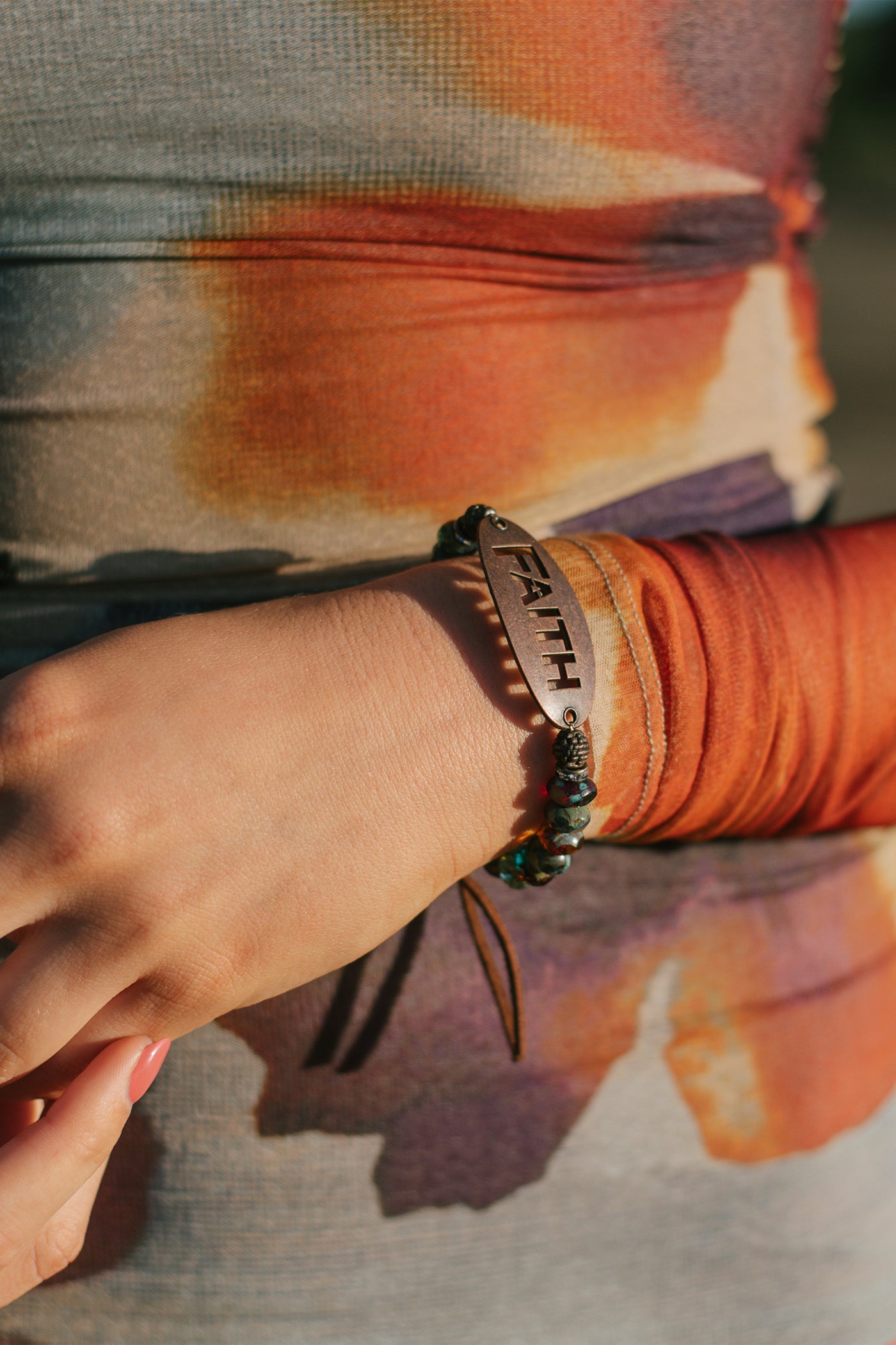 "FAITH" on a Bronze Oval Wrist Charm with Multi Color Czech Fire Polished Beaded Stretch Bracelet and Suede Tie