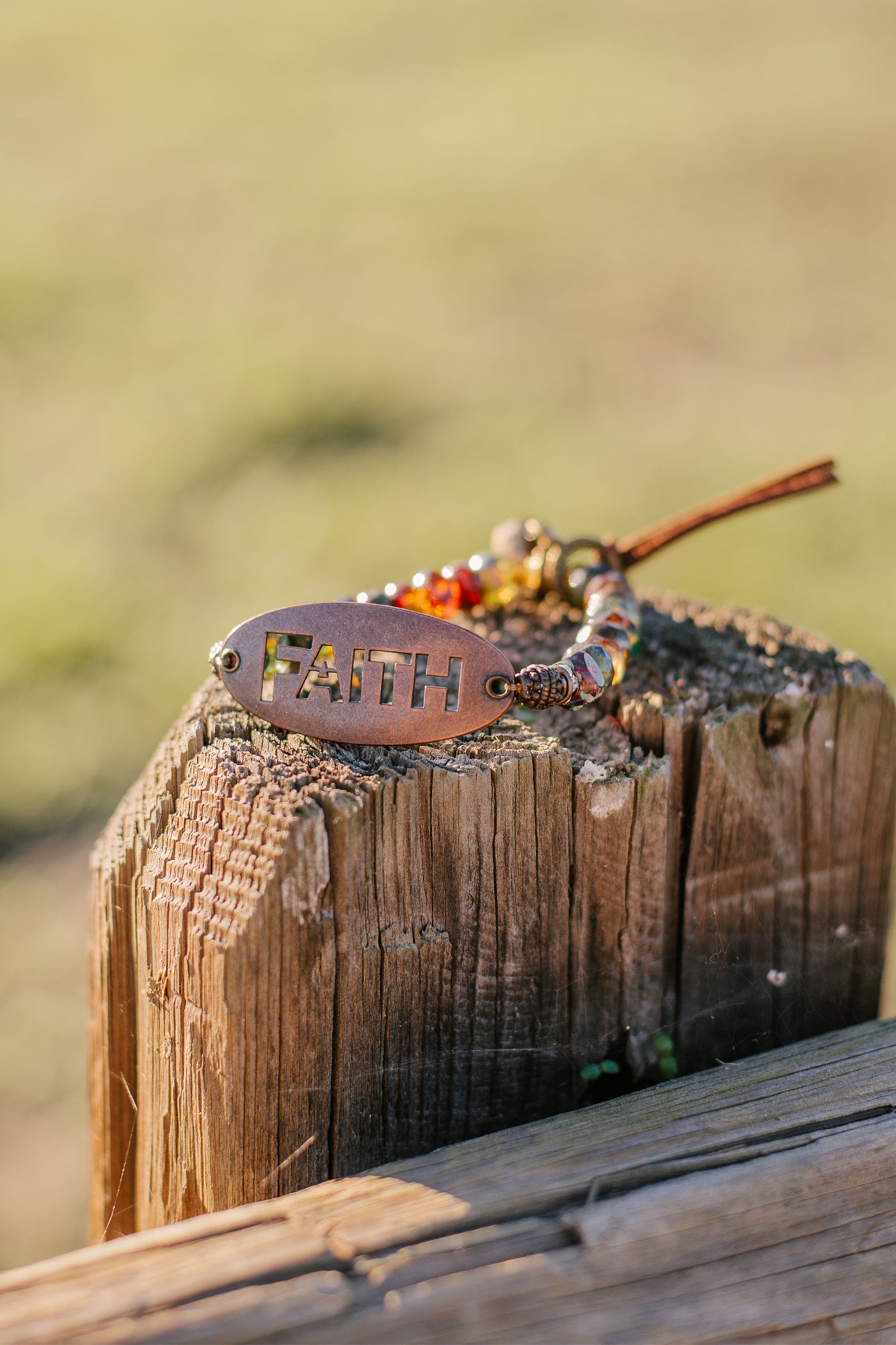 "FAITH" on a Bronze Oval Wrist Charm with Multi Color Czech Fire Polished Beaded Stretch Bracelet and Suede Tie