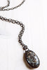 Rutilated Quartz Pendant Necklace with Cross Embellishment and Gunmetal Chain